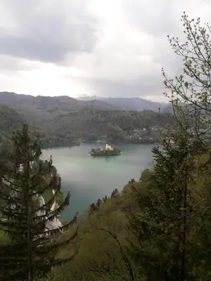 a large ship in the middle of a lake at Apartments Justin in Bled
