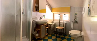 a small bathroom with a sink and a toilet at Apartma AS in Bled