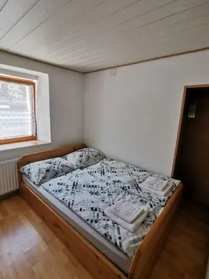 a small bedroom with a bed in a room at Apartma Jerman in Kranjska Gora