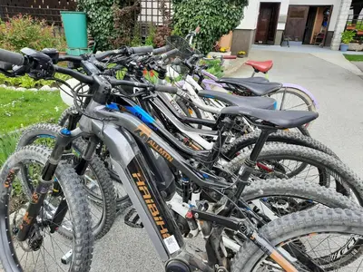 a row of bikes parked next to each other at Snežak (Snowman) 2 in Bohinj