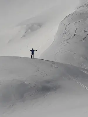 a person standing on top of a snow covered mountain at Snežak (Snowman) 2 in Bohinj