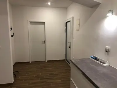 an empty room with two doors and a counter at Jure apartment in Ljubljana in Ljubljana