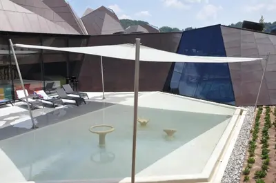 a white umbrella on top of a building at Vas Lipa 8 - 36 in Podčetrtek