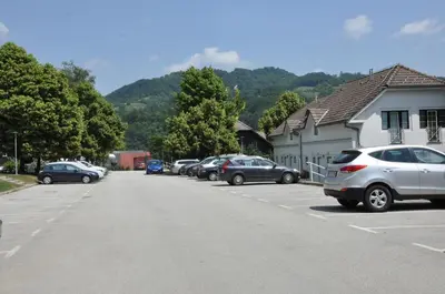a row of cars parked in a parking lot at Vas Lipa 8 - 36 in Podčetrtek