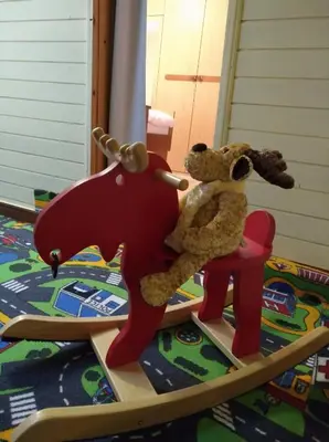 a teddy bear sitting in a chair in a play room at Apartma Pr Martin in Begunje na Gorenjskem