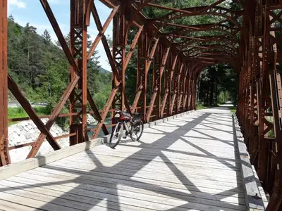 a bike is parked on a bridge at Apartma BaLe in Kranjska Gora