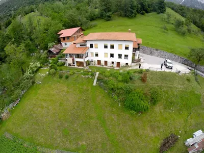 an aerial view of a house on a hill at Apartmaji Berginc in Kobarid