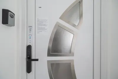 a door with a window in a white refrigerator at Nika & Erik in Kranjska Gora