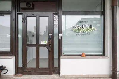a glass door of a building with a sign on it at Nika & Erik in Kranjska Gora