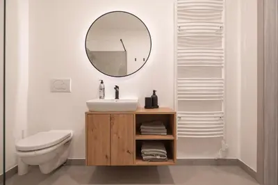 a bathroom with a sink and a mirror at Nika & Erik in Kranjska Gora
