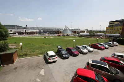 a bunch of cars parked in a parking lot at Elegant central Apt Maribor w/Parking in Maribor