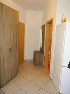 a room with a door and a tiled floor at Apartments FABRKA in Ljubljana