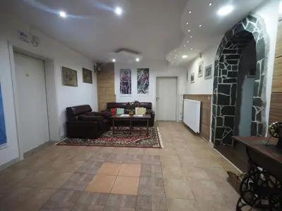 a living room with a couch and a table at Gostilna PIK in Prevalje
