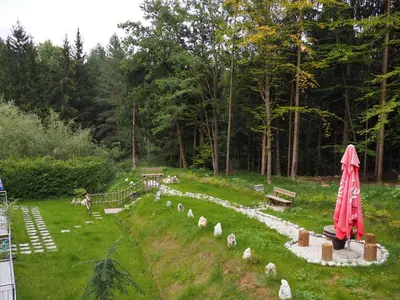 a garden with a bunch of sheep in the grass at Gostilna PIK in Prevalje
