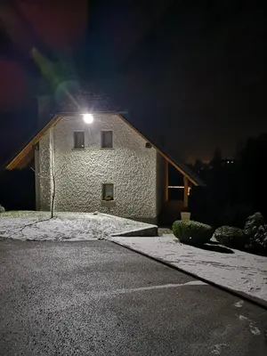 a building with a light on top of it at night at Holiday Home Dobrotin in Vojnik