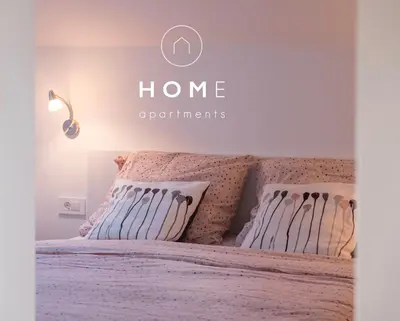a bedroom with a bed with a home improvements sign on it at HOMe apartments & Yoga studio in Bled-Rečica