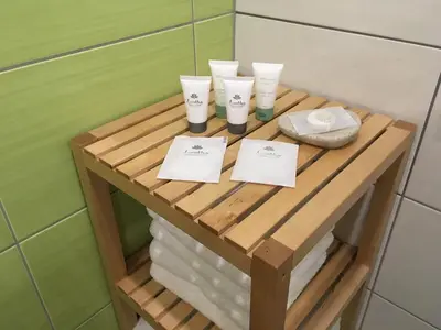 a wooden table with cups and towels on it in a bathroom at Hiša Urška in Log pod Mangartom
