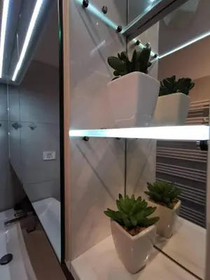 a room with potted plants on a shelf at Apartment MATEA in Kobarid