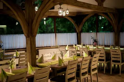 a long dining room with tables and chairs at Guest House Frata in Dvor