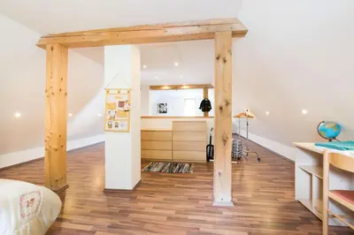 a room with a bed and a desk at Yellow house in Trenta