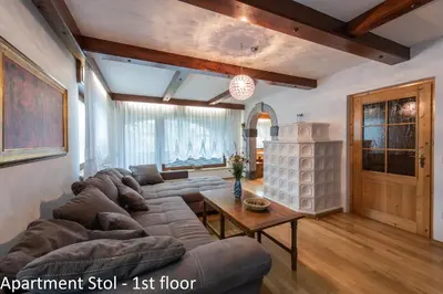 a living room with a couch and a table at Apartments Artemida in Bled