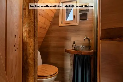 a bathroom with a toilet and a sink at Ranch at Geta in Razgorce