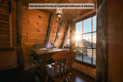 a wooden table in a room with a window at Ranch at Geta in Razgorce
