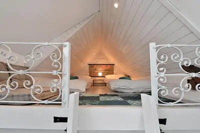 two beds in a room with a attic at Apartment Micnek Bled in Bled