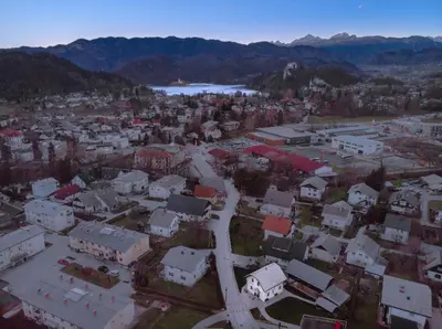 an aerial view of a city with buildings and a road at The Jungle Apartments and Rooms (Vila Džungla) in Bled