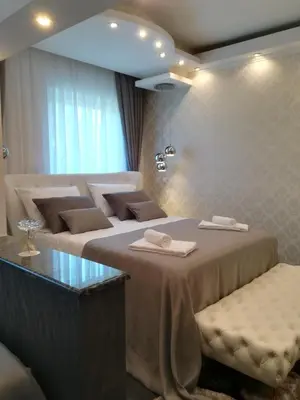 a hotel room with two beds with towels on them at Vila Lemic Postojna in Postojna