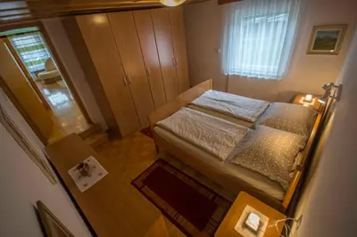 an overhead view of a small bedroom with a bed at apartma mojca in Bohinj