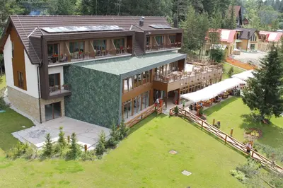 an aerial view of a house with a large yard at Hotel Rakitna in Rakitna