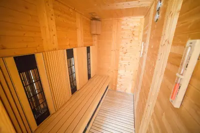 an inside view of a sauna with wooden walls at Hotel Rakitna in Rakitna