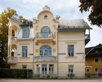a large building with a balcony on the side of it at Vila Ana Generoes Bled in Bled