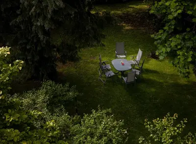 an overhead view of a table and chairs in the grass at Vila Ana Generoes Bled in Bled