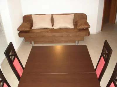 a living room with a couch and a table at Apartments Lake Bohinj in Bohinj