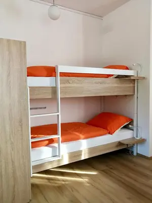 a bedroom with two bunk beds in a room at Frankovič Bed&Breakfast in Vinica