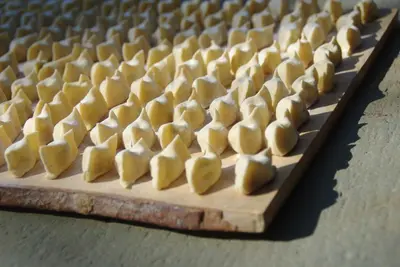 a wooden board with heart shaped food on it at Tourist Farm Zelinc in Cerkno