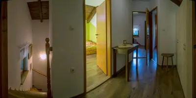 a hallway with a room with a bed and a table at Holiday House Vodice na Lazu in Zoll