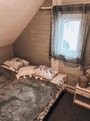 a bedroom with two twin beds and a window at Holiday House Franc in Srednja Vas v Bohinju