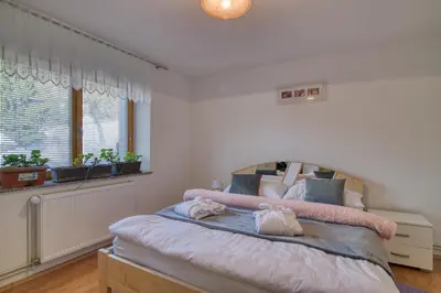 a bedroom with a bed and a window at Robida in Vransko