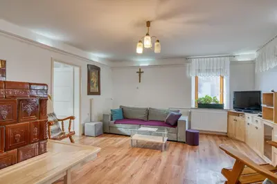 a living room with a couch and a table at Robida in Vransko