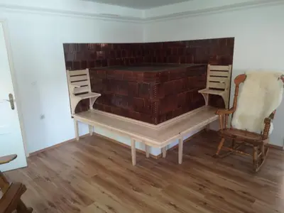 a room with a brick wall and a table and chairs at Robida in Vransko