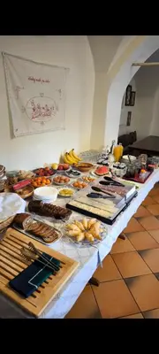 a table with many different types of food on it at Resort Vidmar near Bled - rooms Vidmar in Lesce