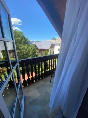 a balcony with a bench and a window at Resort Vidmar near Bled - rooms Vidmar in Lesce