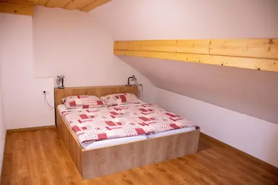 a bed in a room with a bunk bed at Farmhouse Soklic in Bohinj