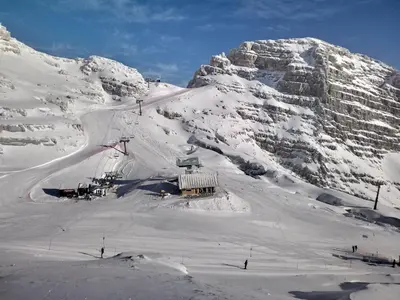 a snow covered mountain with a ski lift on it at Beti Blu, Kaninska vas in Bovec