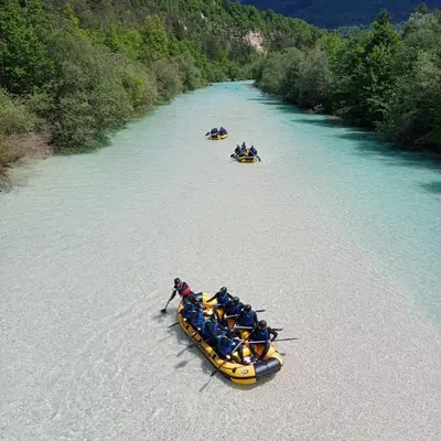 a group of people in boats on a river at Apartmaji SLATENIK in Bovec