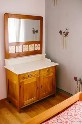 a bathroom with a sink and a mirror at Pr'Gavedarjo Eco Heritage B&B in Kranjska Gora