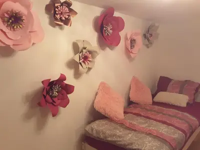 a room with pink flowers on the wall at DELUX duplex apartment in Maribor